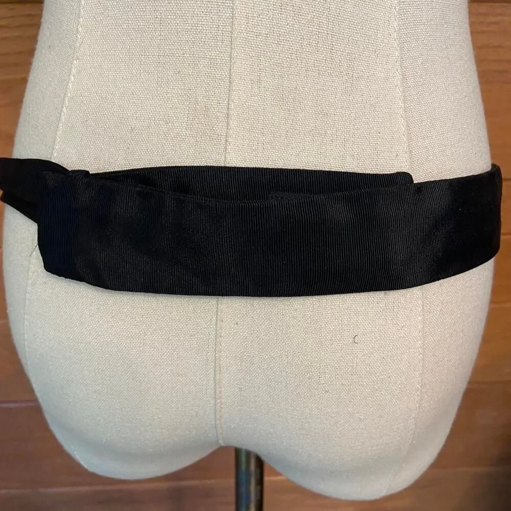 Vintage 80s Carolyn Tanner lion gold tone buckle black fabric rope belt
